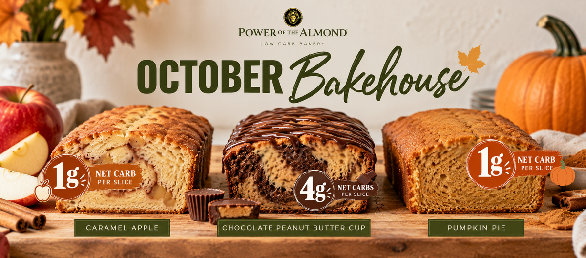 Promotional banner for Power of the Almond Low Carb Bakes featuring three loaves of bread on a rustic wooden table: Caramel Apple, Chocolate Peanut Butter Cup, and Pumpkin Pie, with autumn decorations including pumpkins, apples, cinnamon sticks, and fall leaves.